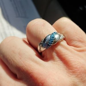 Gorgeous designer sterling silver blue an white diamond slanted ring.